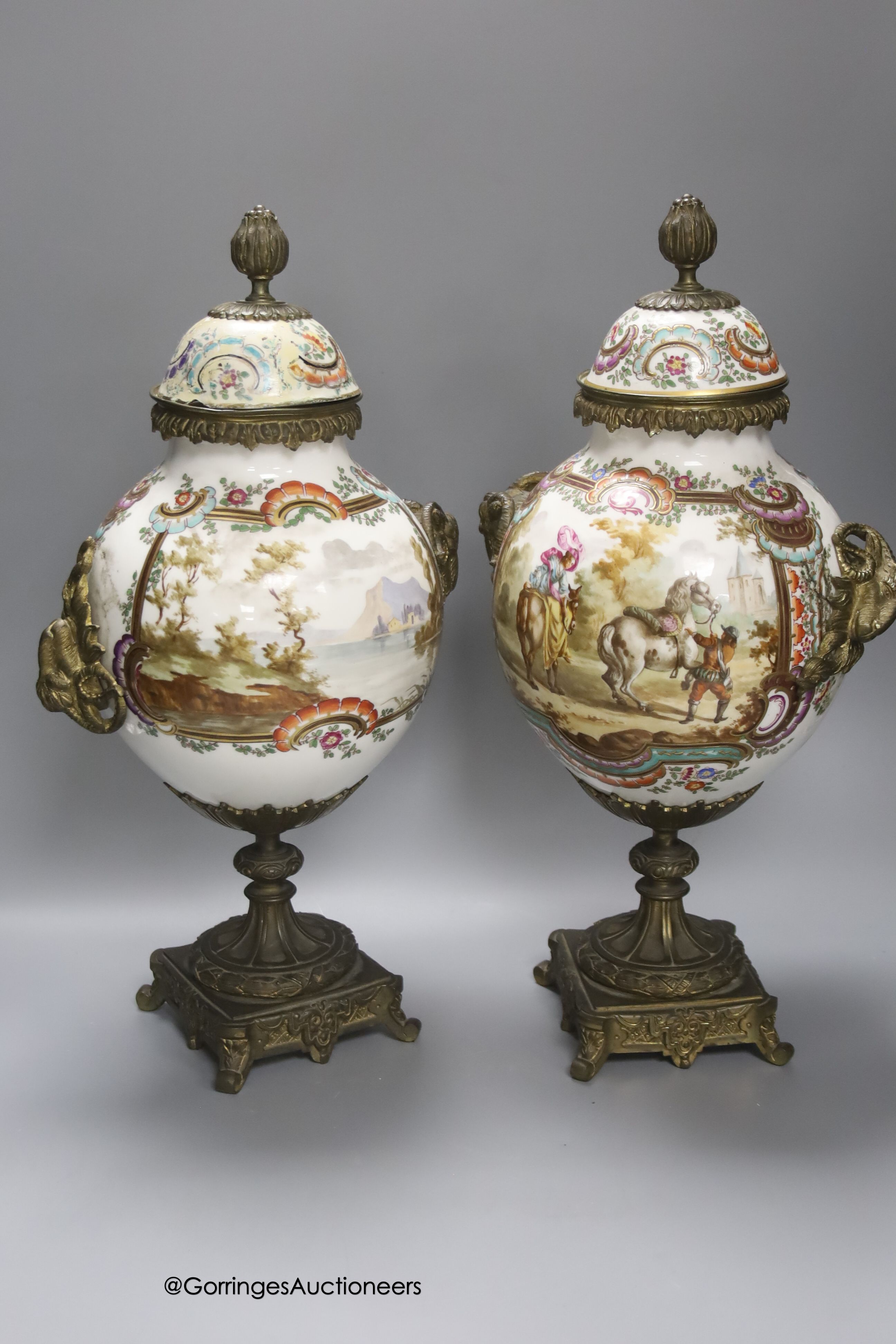 A pair of 19th century German ormolu mounted porcelain jars and covers, 41cm